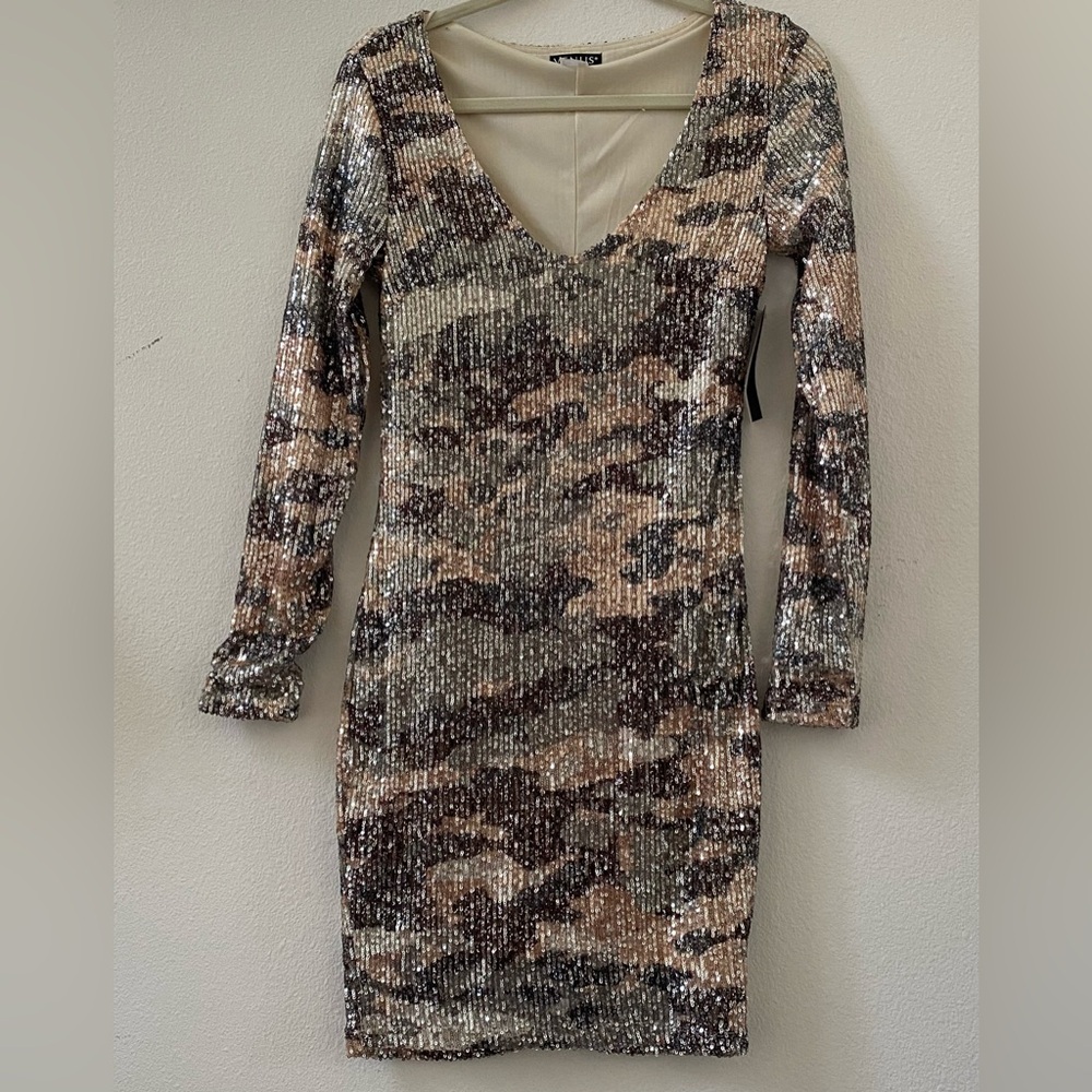 Sequined camo minidress.
New with tag.